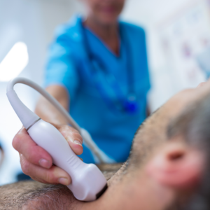 man getting thyroid ultrasound